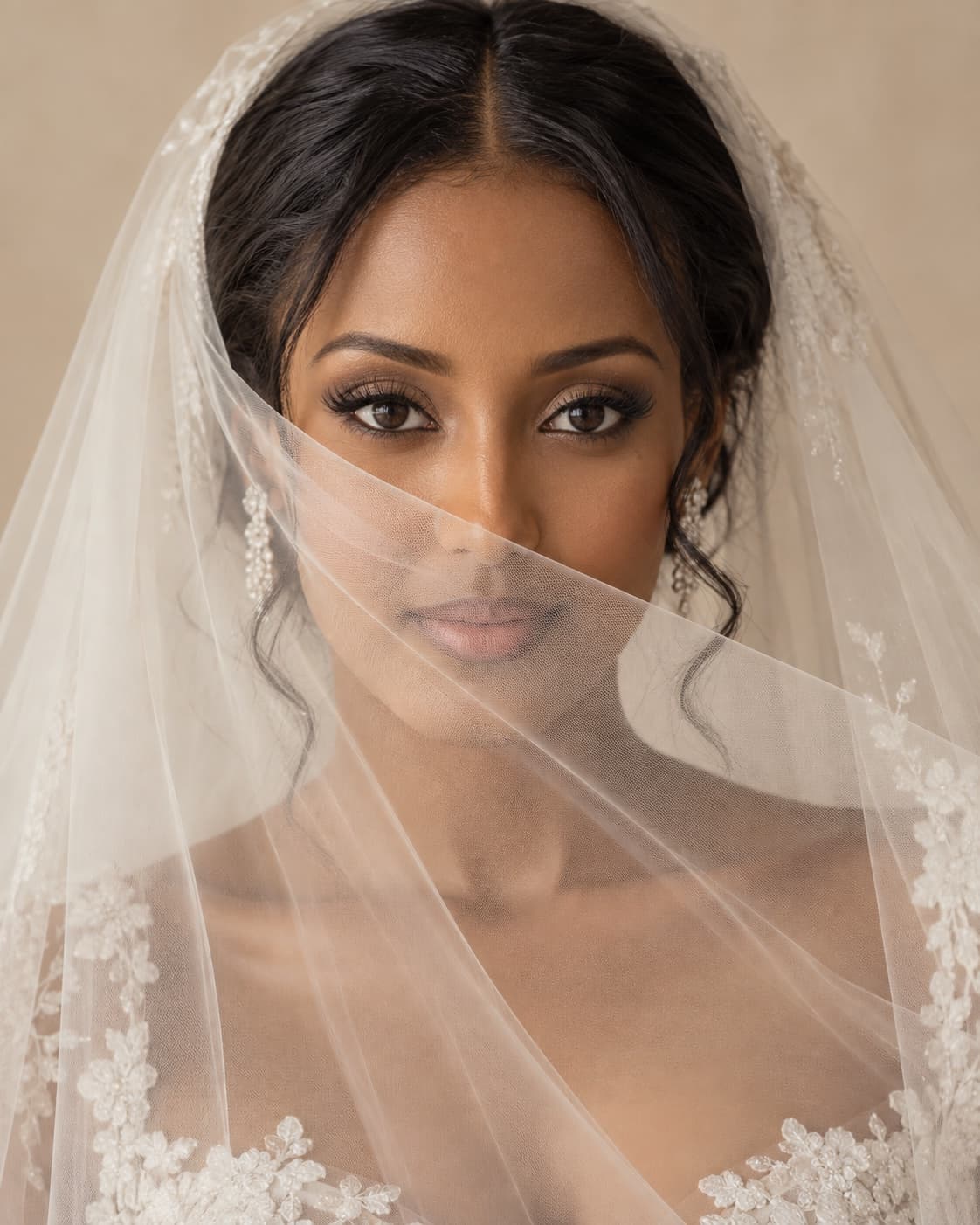 Bride with her veil drawn across her face